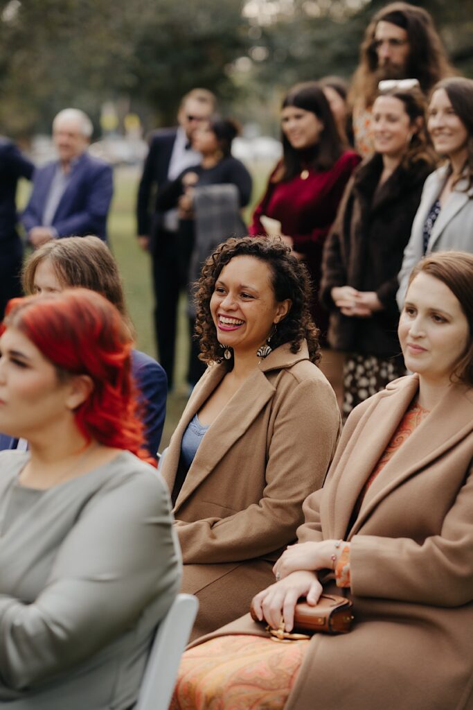 039_Guest smiling at wedding ceremony in the Edinburgh Gardens Fitzroy