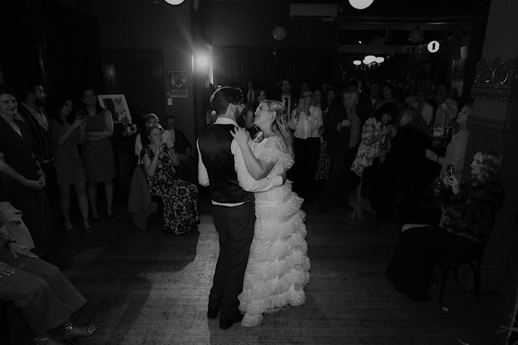 126_fitzroy gardens pinnacle wedding Bride and groom dancing at their fitzroy pub wedding