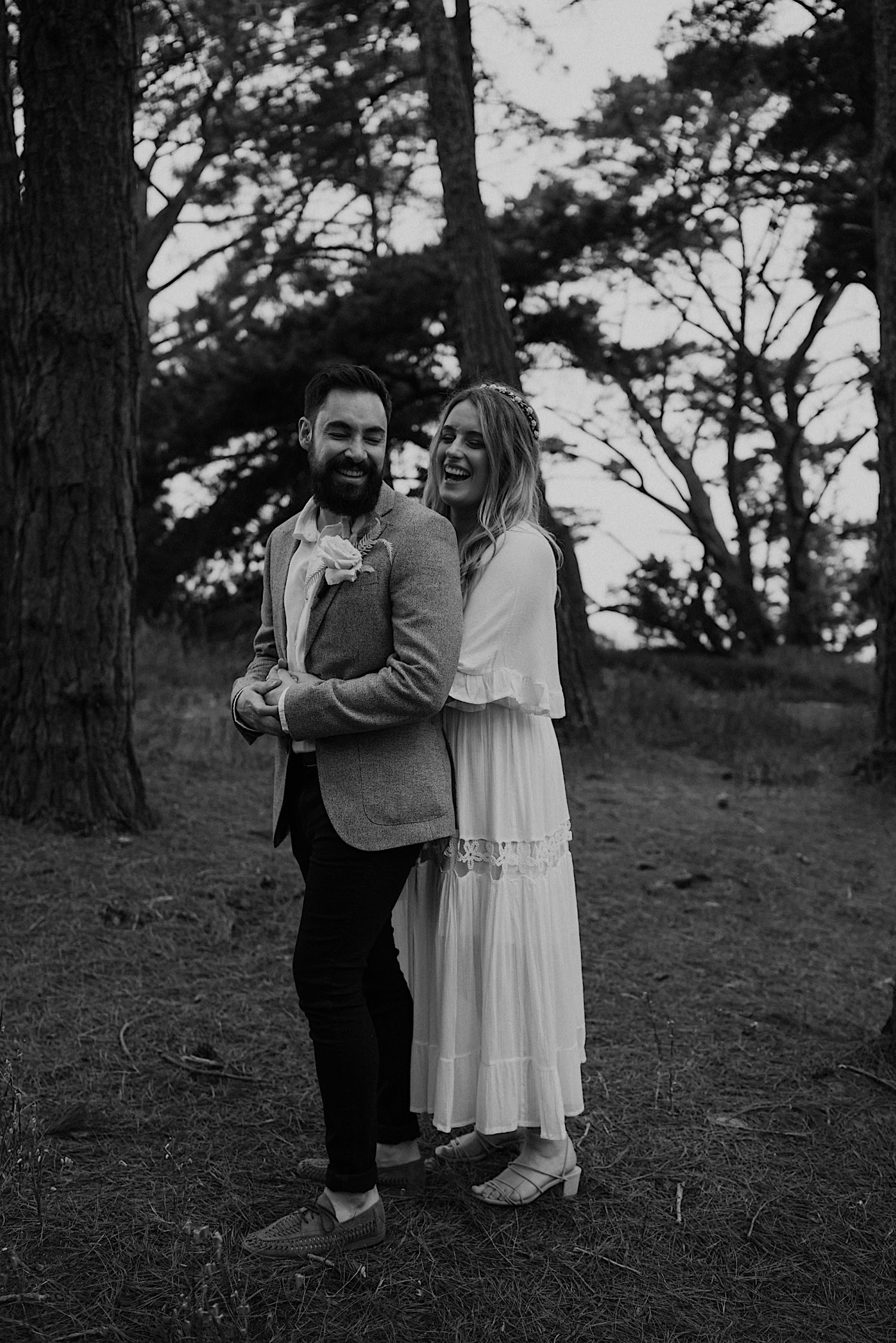 48_Flinders Elopement Mornington Peninsula Wedding couple having a cuddle in the shoreham pines after their wedding ceremony