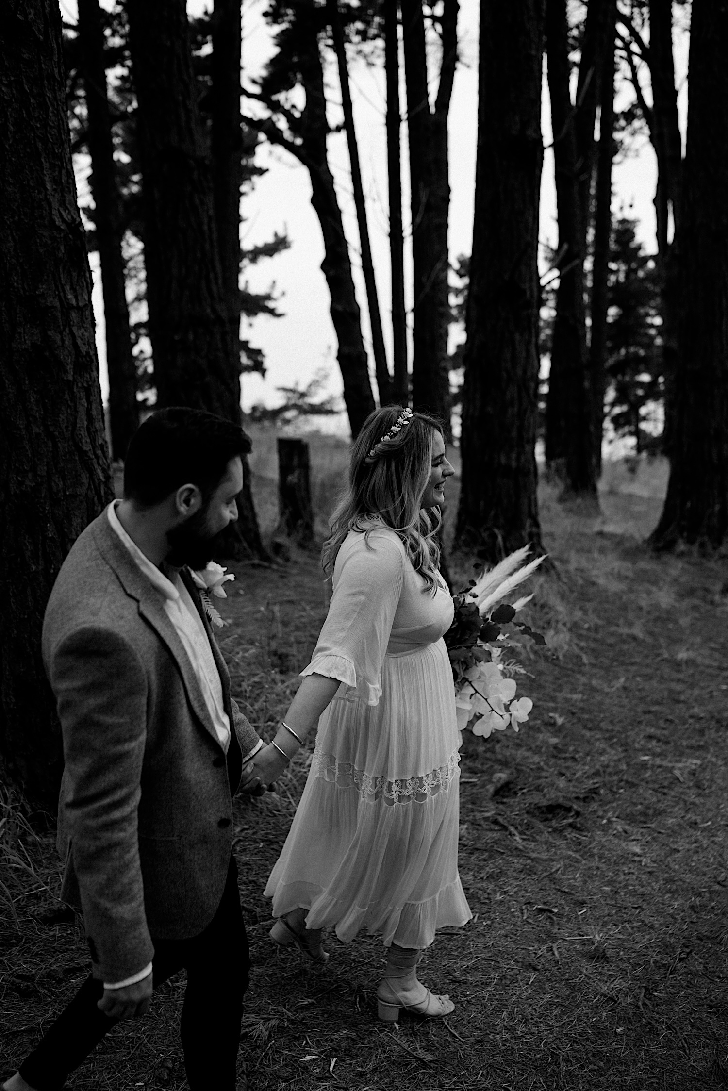 49_Flinders Elopement Mornington Peninsula Wedding bride and groom walking through the shoreham pines after their wedding ceremony