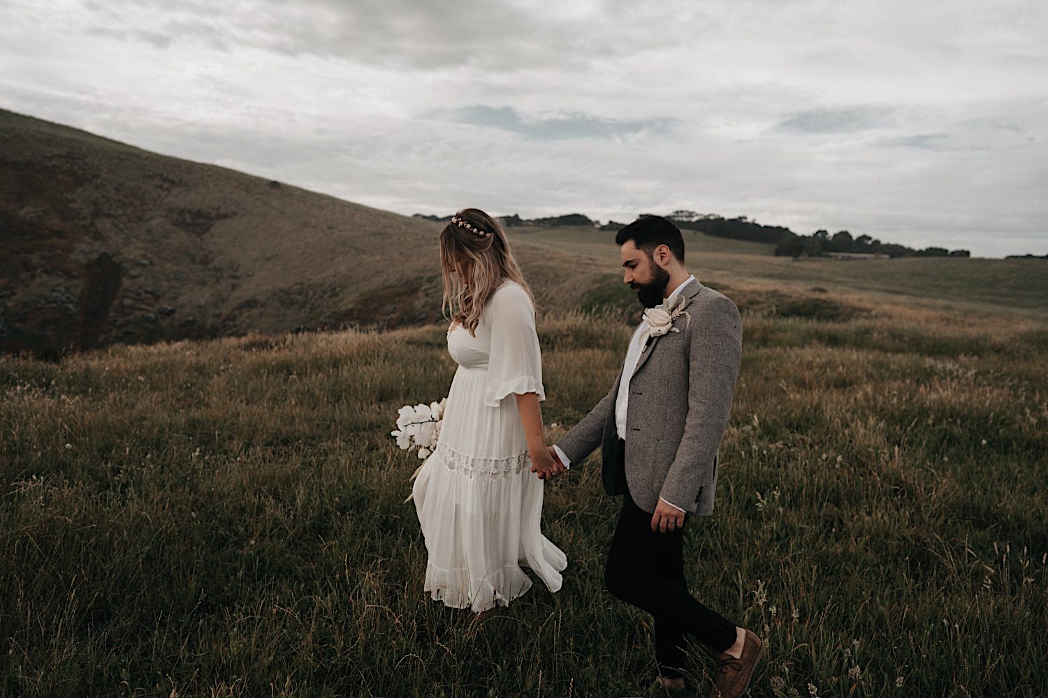 58_Flinders Elopement Mornington Peninsula Wedding couple walking on the cliffs in Flinders after their Elopement