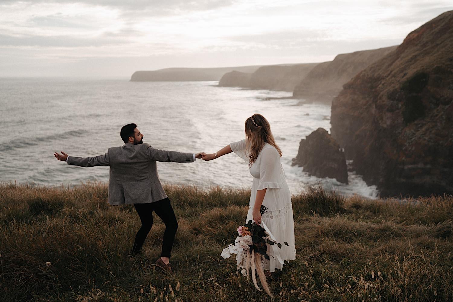 62_Flinders Elopement Mornington Peninsula Wedding Bride and groom dancing near flinders cliffs