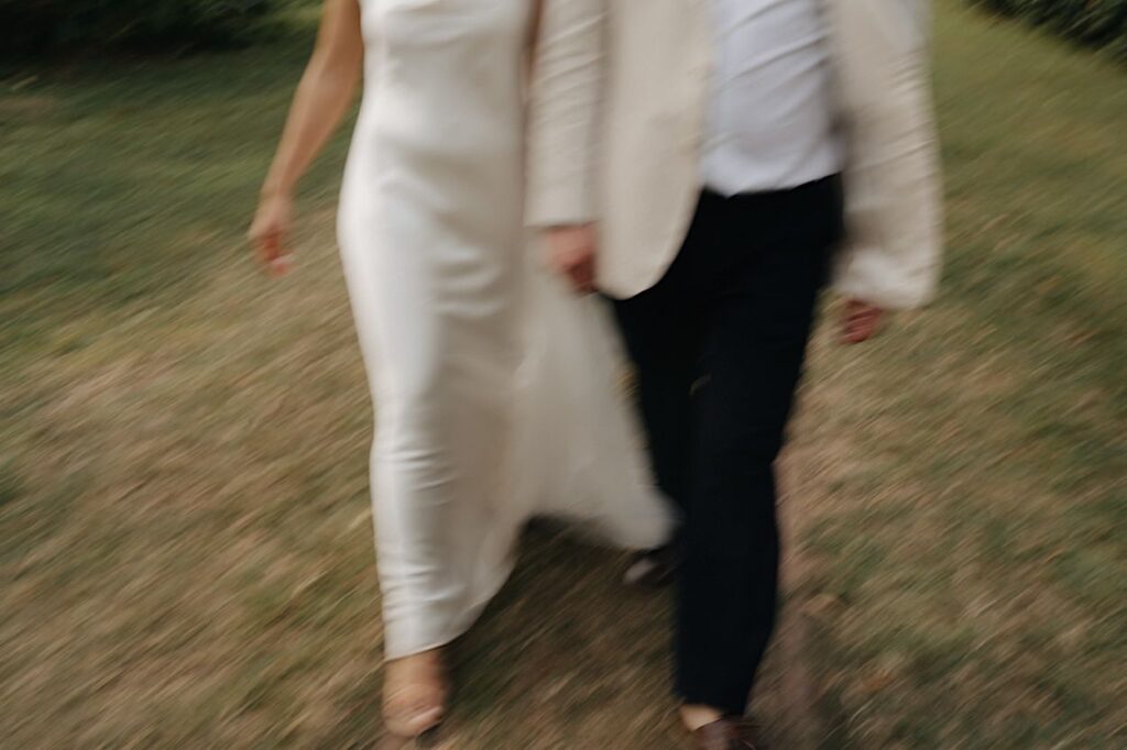 156_detail-of-bride-and-groom-during-portraits-intercontinental-wedding Detail of bride and groom during portraits at Intercontinental Wedding, with a motion blur effect of the couple’s feet as they walk