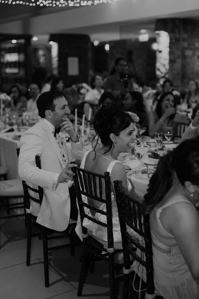 251_couple-laughing-speeches-navo-wedding-reception-fiji Couple laughing during speeches at their wedding reception at Navo Restaurant, Intercontinental Resort, Fiji