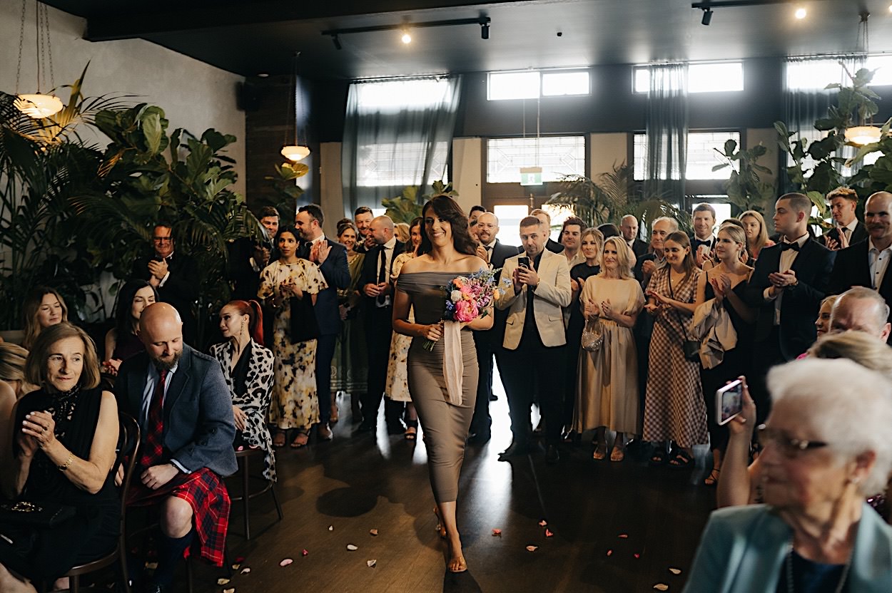 070_bridesmaid-enters-glasshaus-brucke-wedding-melbourne bridesmaid-enters-glasshaus-brucke-wedding-melbourne