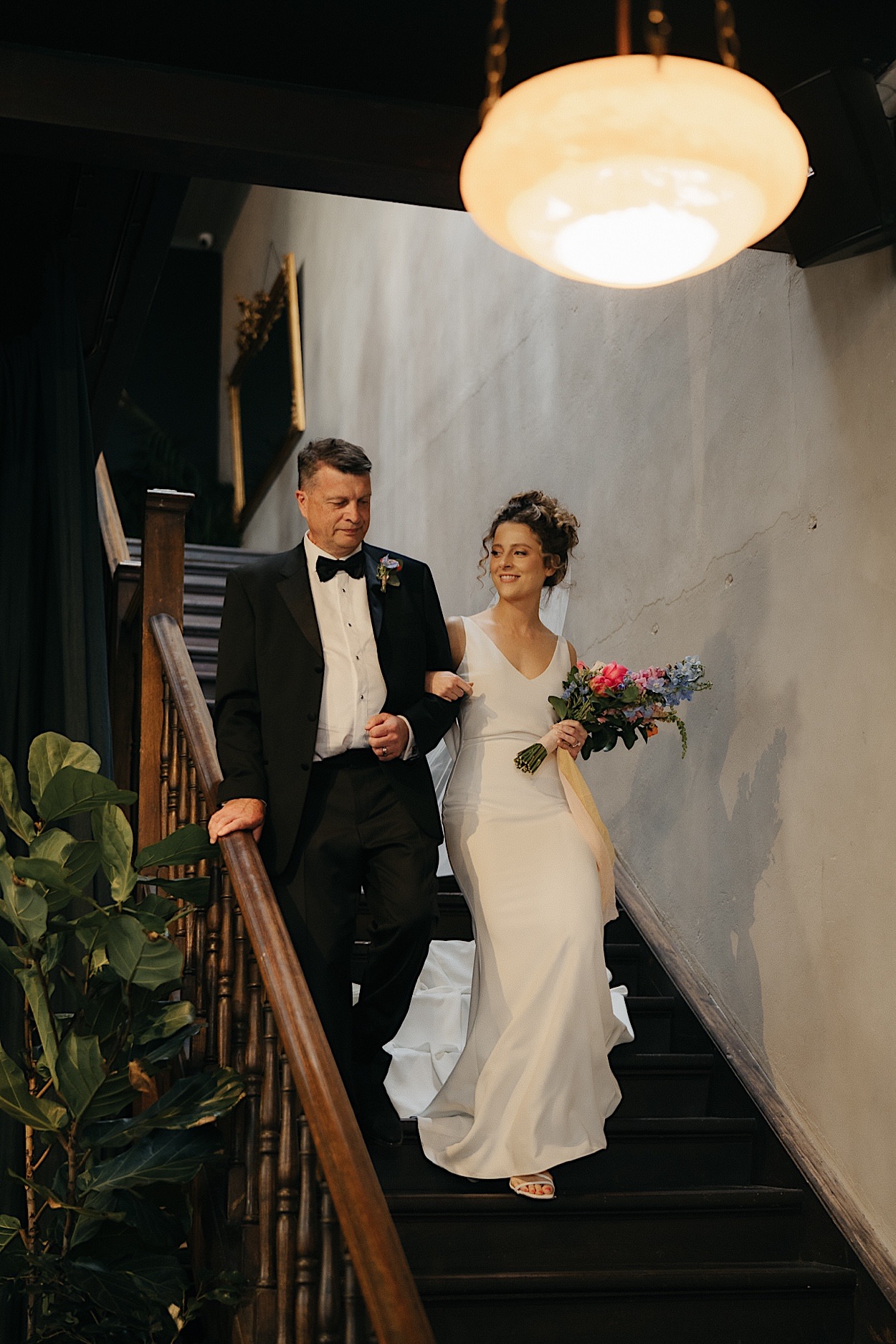 074_brides-aisle-entrance-glasshaus-brucke-wedding-richmond-melbourne Bride smiling at her groom as she enters the aisle during the Glasshaus Brucke wedding in Richmond, Melbourne