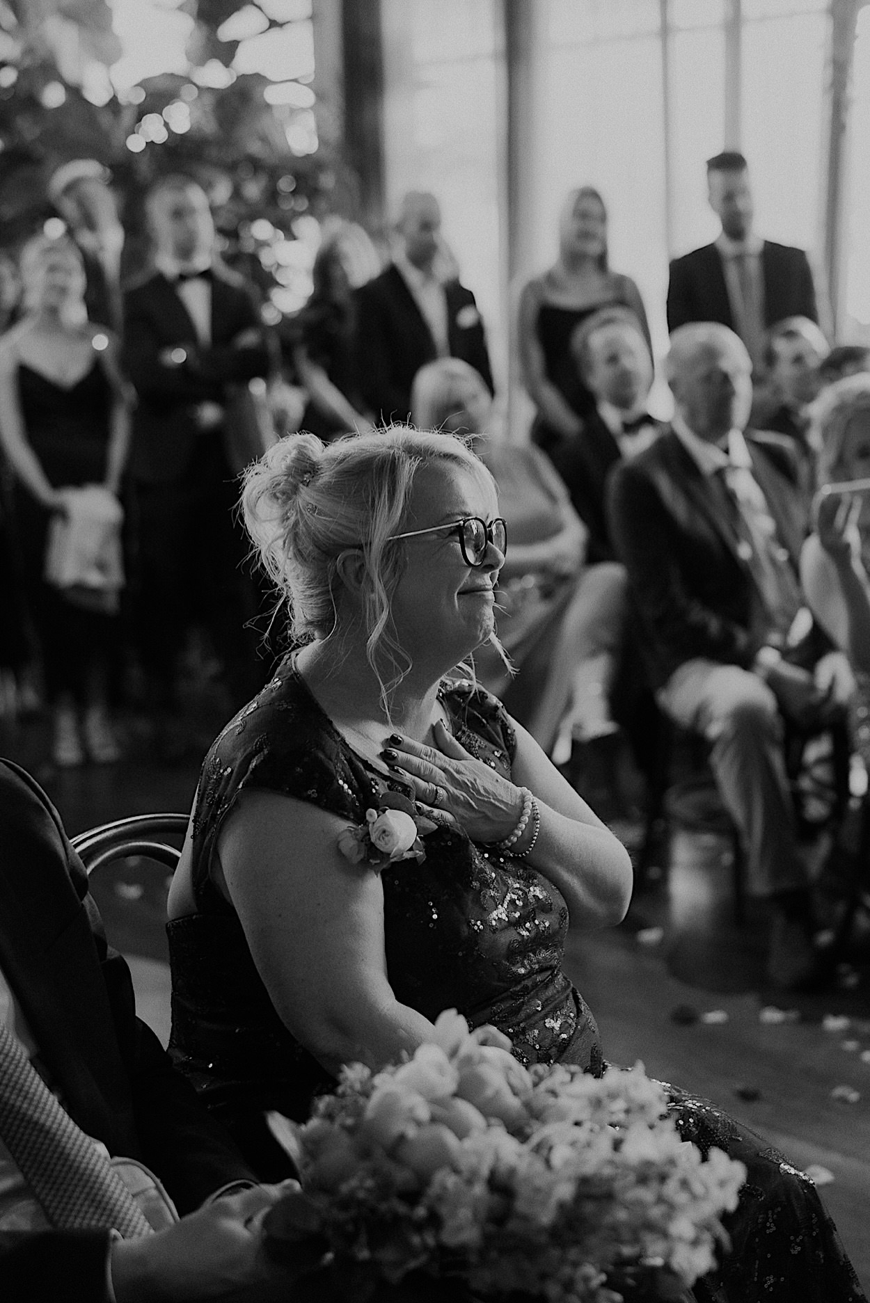 090_grooms-mum-glasshaus-brucke-wedding-richmond grooms mother holding her chest and having a teary moment at the Glasshaus Brucke wedding in Richmond, Melbourne