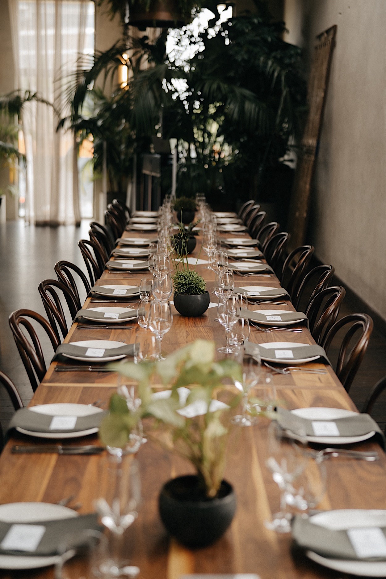 116_reception-styling-glasshaus-brucke-wedding-melbourne Stylish reception decor at Glasshaus Brucke in Melbourne, featuring elegant table settings and floral arrangements