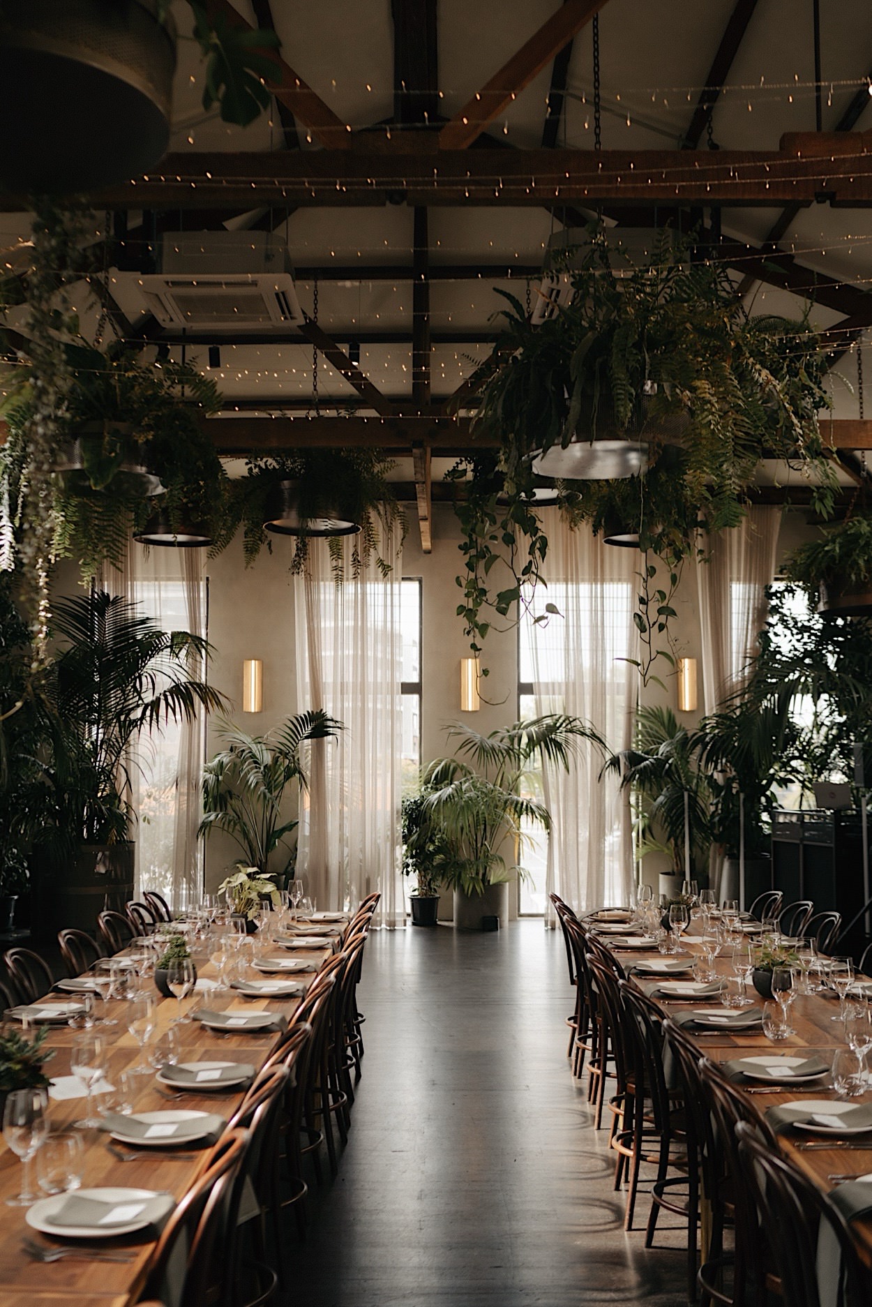 118_glasshaus-brucke-wedding-reception-styling-melbourne Beautiful reception styling at Glasshaus Brucke in Melbourne, with elegant tables, floral arrangements, and modern decor