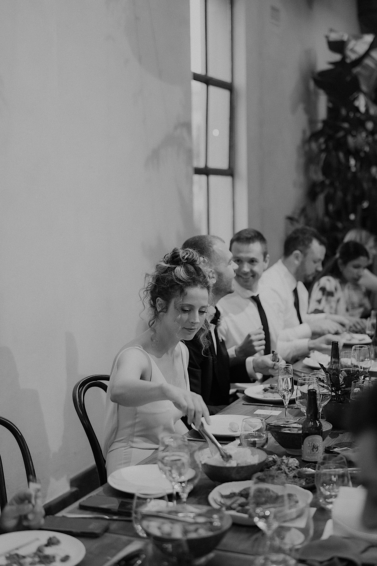 168_bride-glasshaus-brucke-wedding-richmond-melbourne Bride serving dinner at a wedding reception at Glasshaus Brucke in Richmond, Melbourne