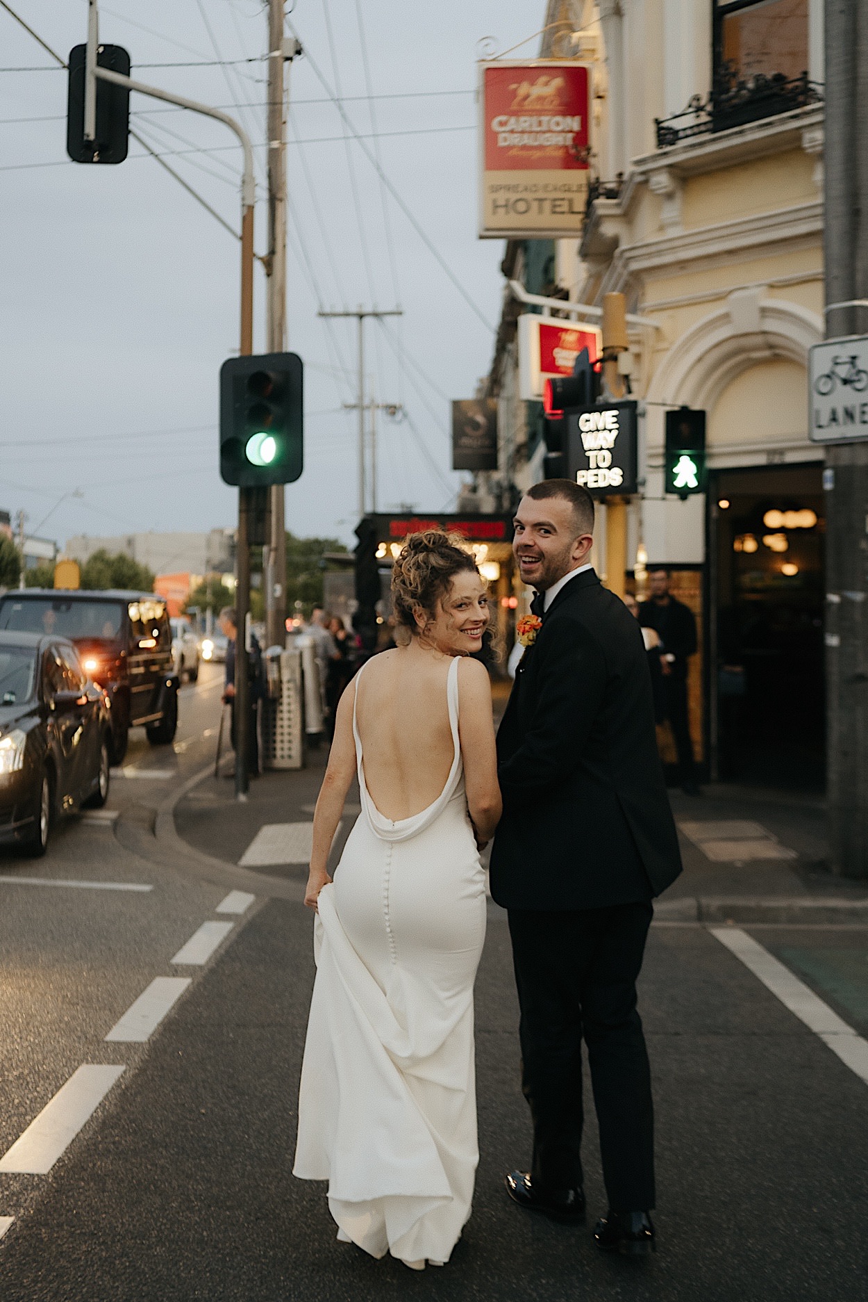 170_dusk-portraits-glasshaus-brucke-wedding-richmond-melbourne Couple posing for dusk portraits at a wedding at Glasshaus Brucke in Richmond, Melbourne, looking back at the camera
