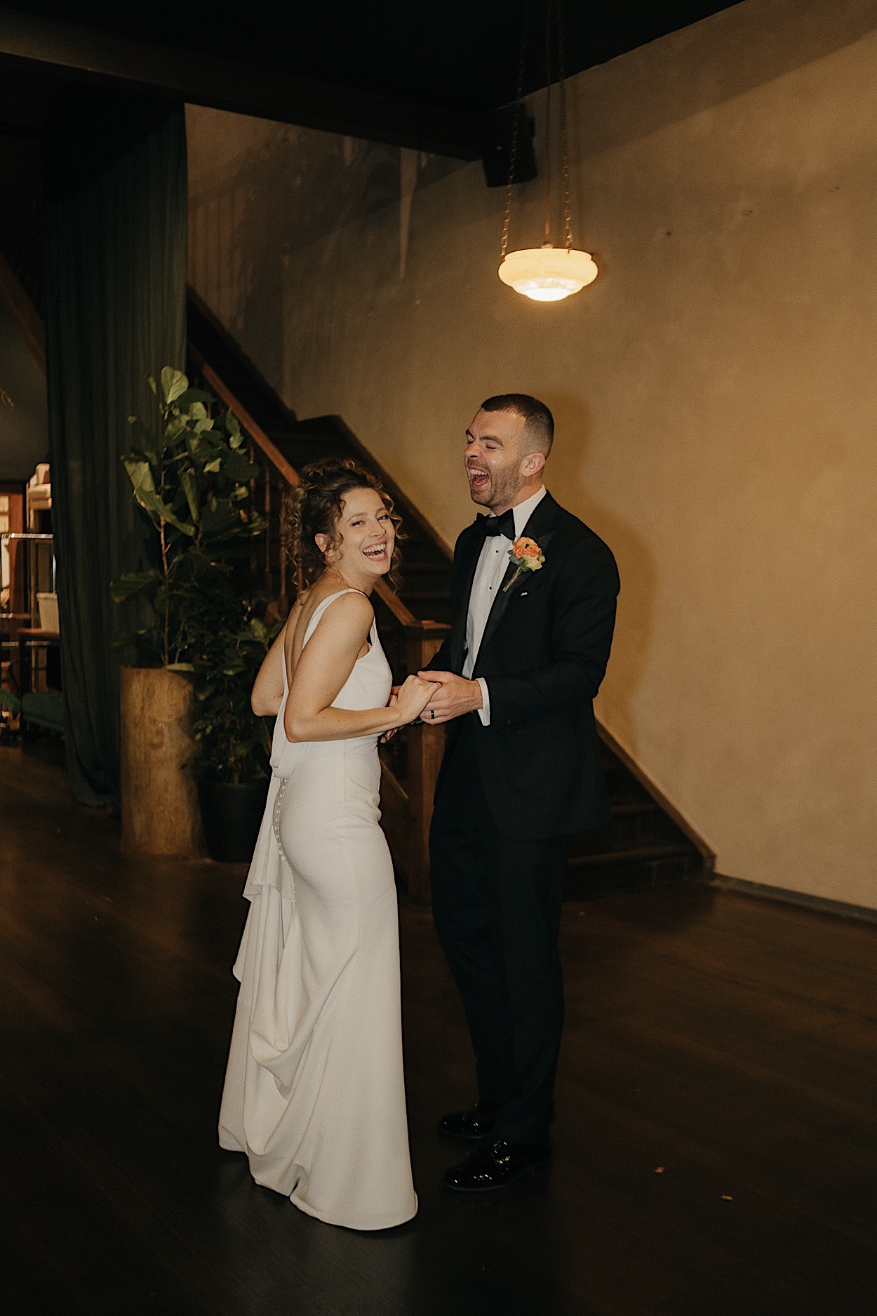 179_glasshaus-brucke-wedding-portraits-during-reception Bride and groom laughing at the camera during their wedding portraits at Glasshaus Brucke, captured during the reception by a Melbourne photographer