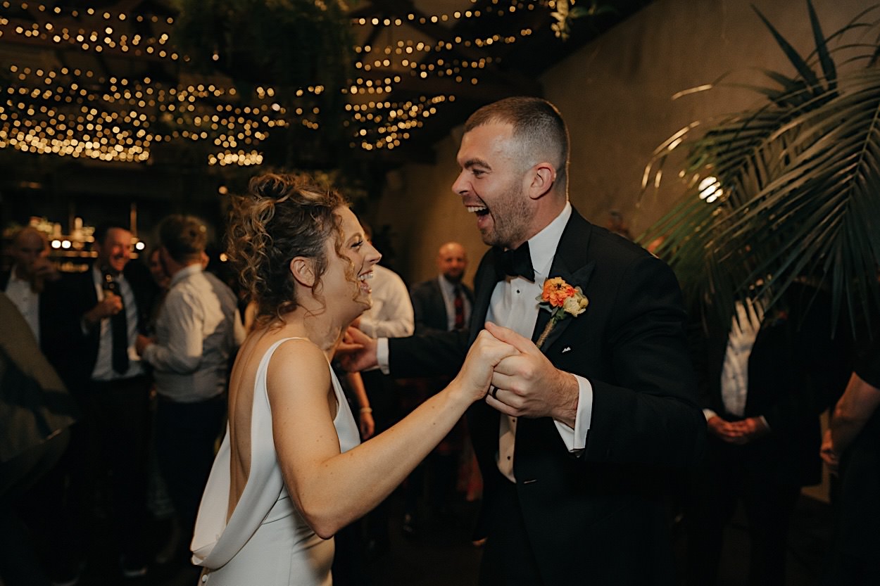 192_couple-on-dancefloor-captured-by-melbourne-wedding-photographer Bride and groom laughing on the dancefloor during their wedding, captured by a Melbourne wedding photographer