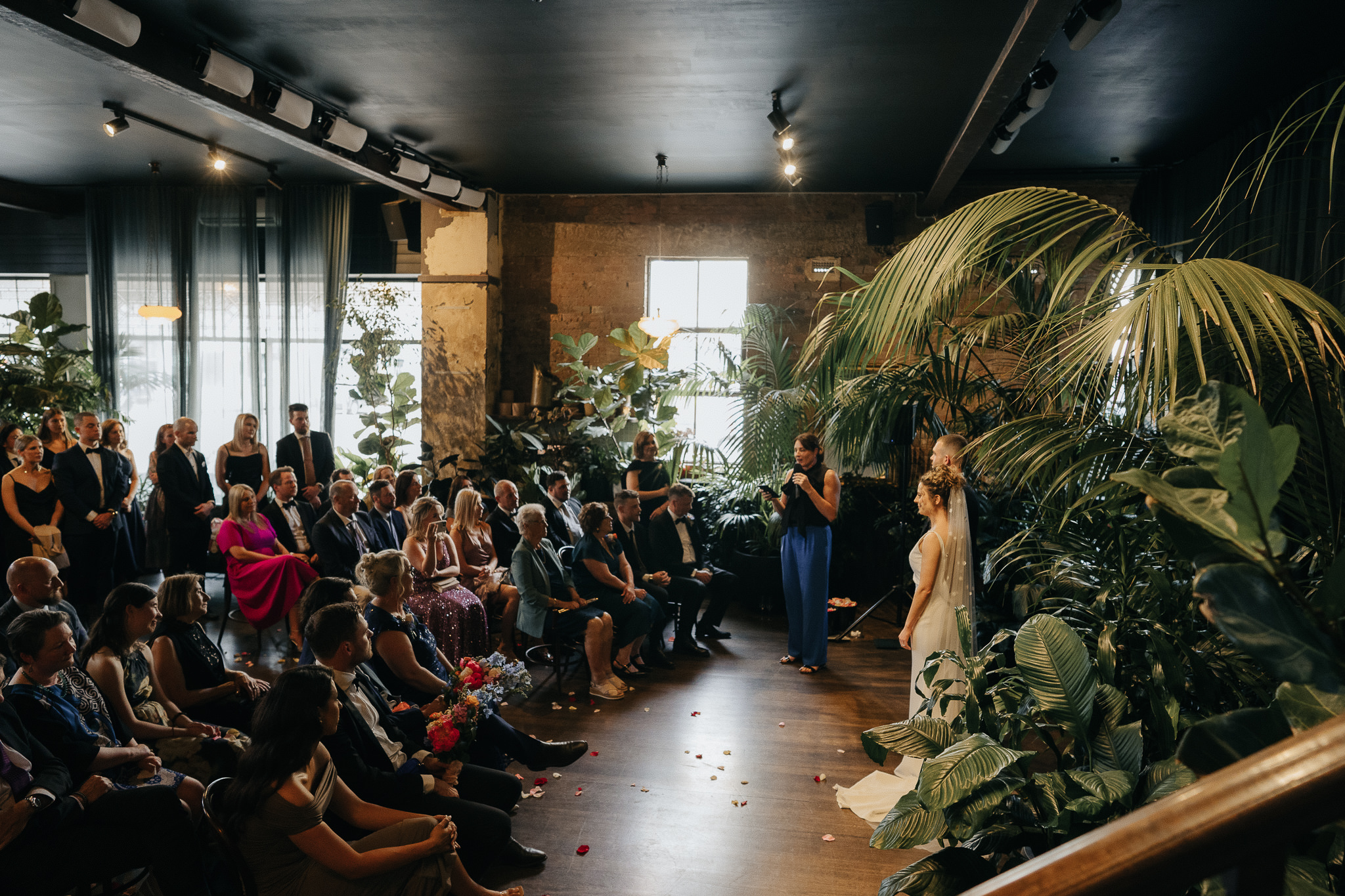 84_melbourne-photographer-captures-glasshaus-brucke-ceremony Wide shot of the Glasshaus Brucke wedding ceremony in Melbourne, captured by the photographer, showing all guests and participants in view
