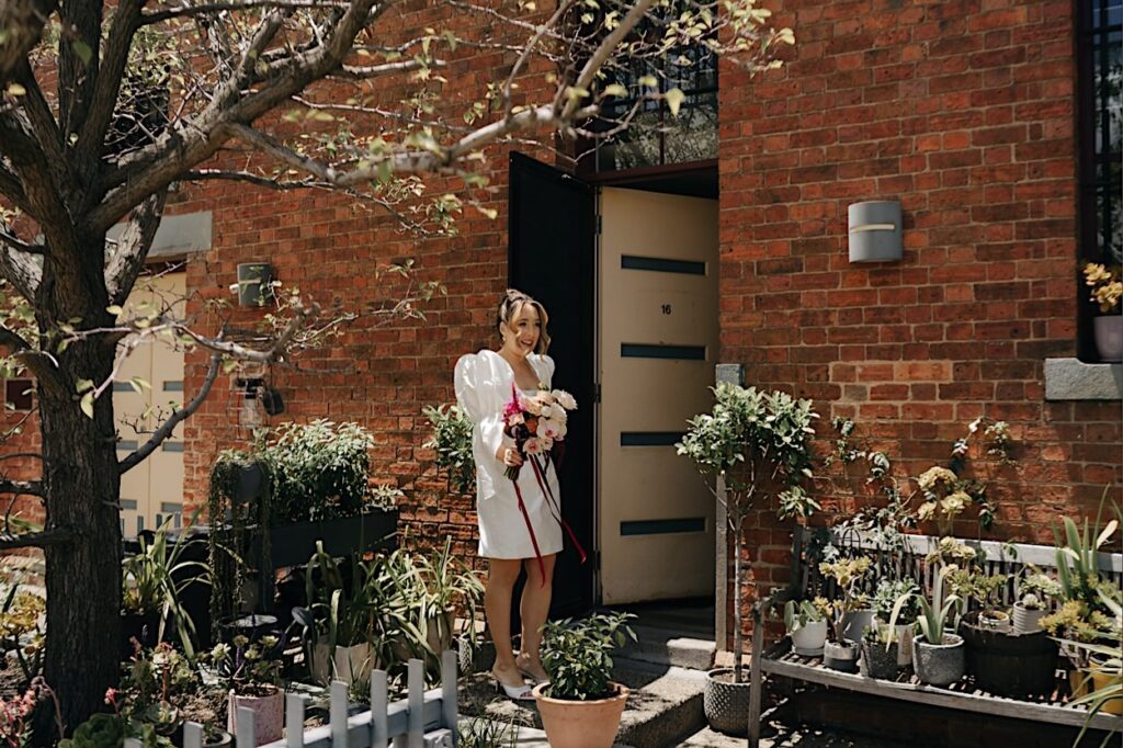 036_couple-leaving-for-altar-electric-ceremony-collingwood Bride walking out the front door, leaving for her ceremony at Altar Electric, Collingwood, Melbourne