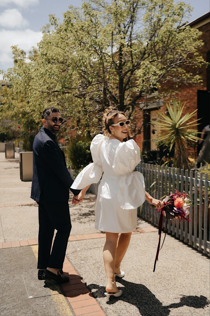 046_bride-groom-portraits-altar-electric-ceremony-collingwood-melbourne Bride and groom walking back into their apartment before their ceremony at Altar Electric, Collingwood, Melbourne.