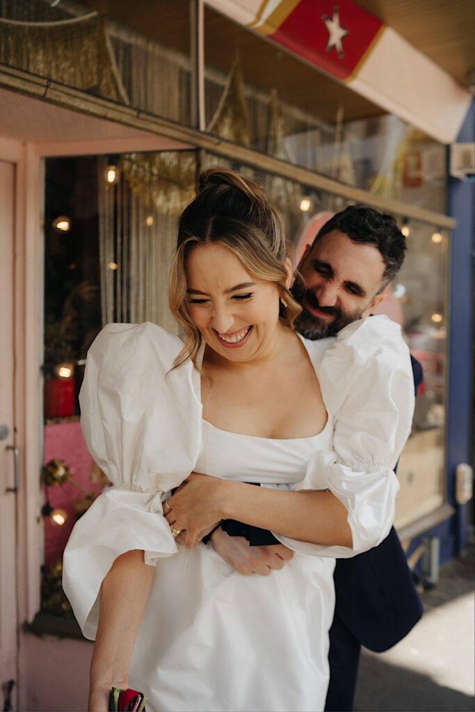 118_couple-portraits-after-altar-electric-wedding-collingwood Bride and groom laughing and cuddling during their portrait session at Altar Electric wedding in Collingwood