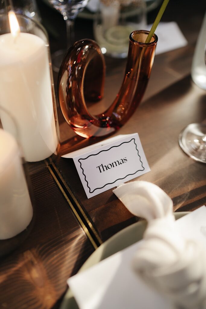 Close-up of a place card at a Glasshaus Inside wedding.